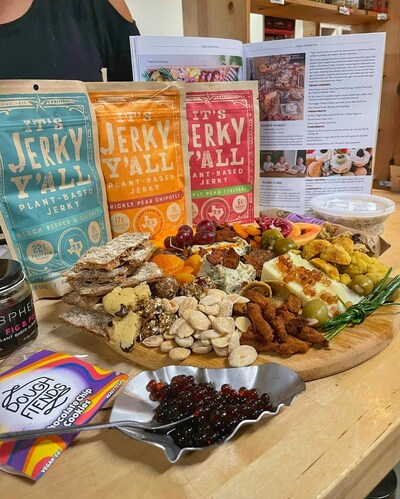 plant-based jerky on rustic wood with cacti and spices in warm sunlight