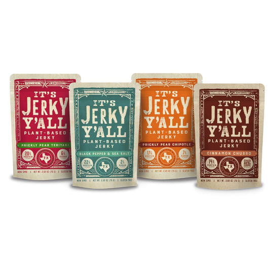 Four packs of 'It's Jerky Y'all' plant-based snacks in Prickly Pear Teriyaki, Black Pepper & Sea Salt, Prickly Pear Chipotle, and Cinnamon Churro flavors