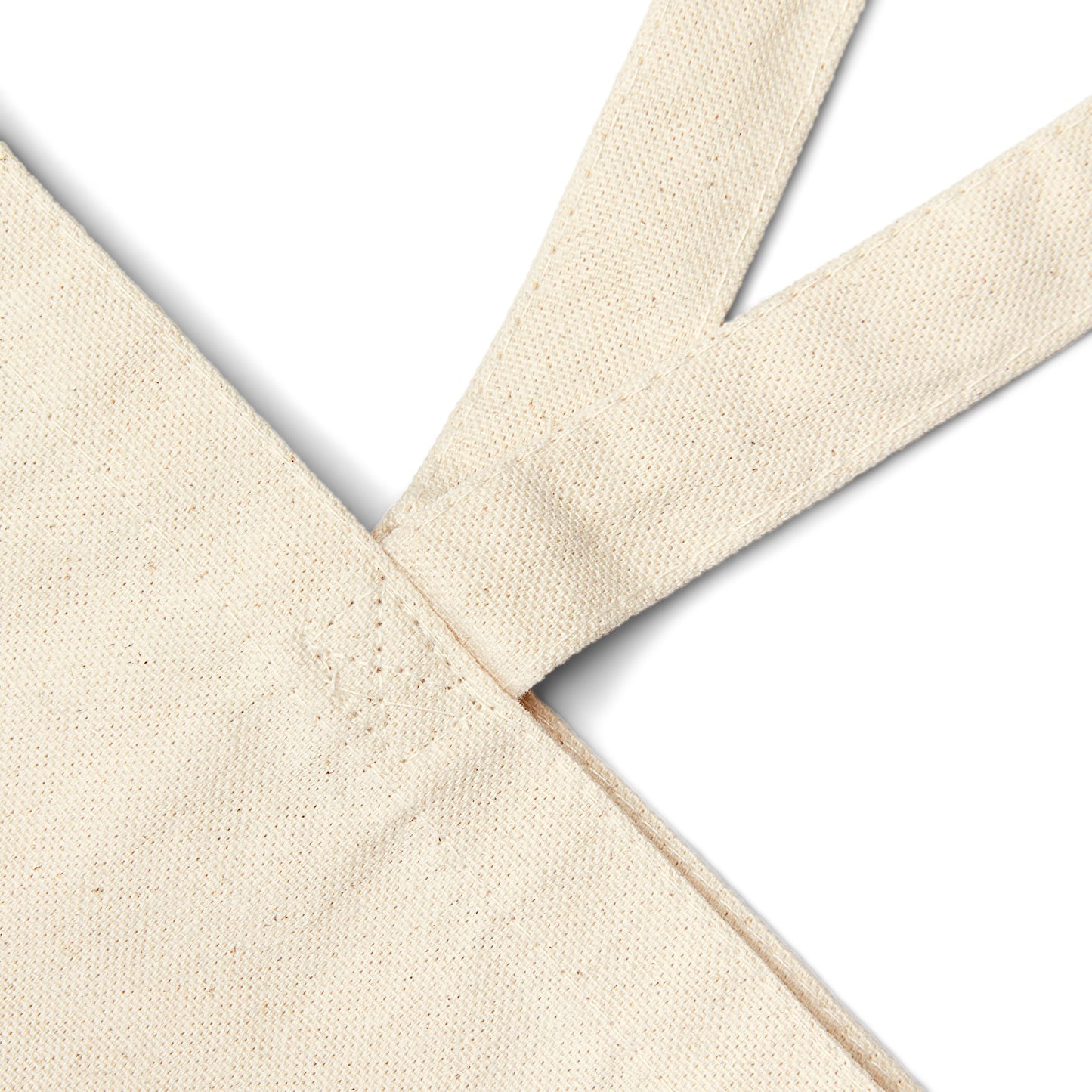 Close-up of a durable cotton canvas tote bag, showcasing reinforced stitching on the handles, perfect for those looking for a sturdy and eco-friendly canvas tote bag for daily use.