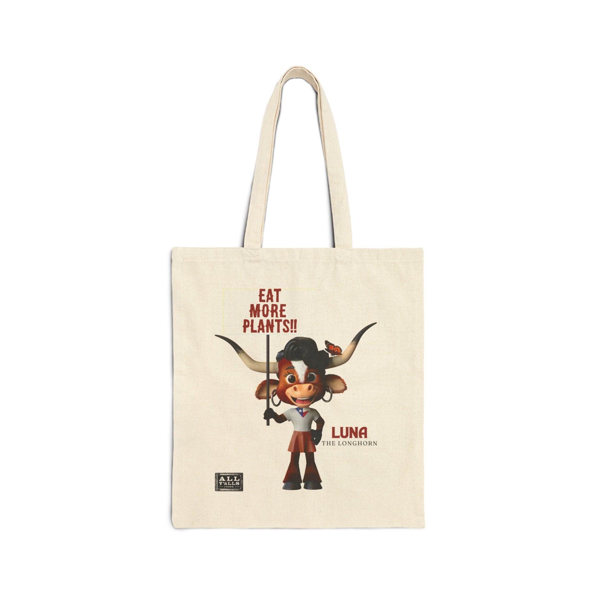 Cotton tote bag featuring Luna the Longhorn with the message 'Eat More Plants!!,' ideal for eco-conscious shoppers looking for a reusable and stylish cotton tote bag.