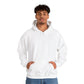 Model wearing a comfy hooded sweatshirt in plain white, featuring a relaxed fit with a front pocket and drawstring hood, perfect for casual comfort.