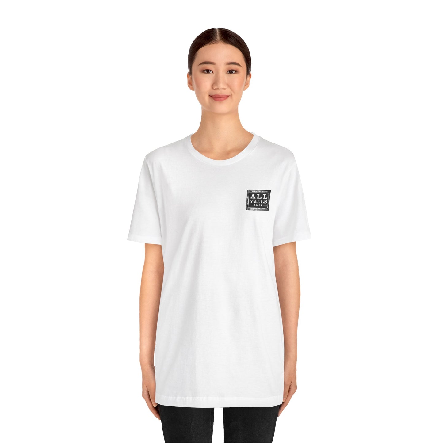 Model wearing a white short sleeve tee featuring a small 'All Y'alls' logo on the chest, offering a comfortable and relaxed fit ideal for everyday casual style.