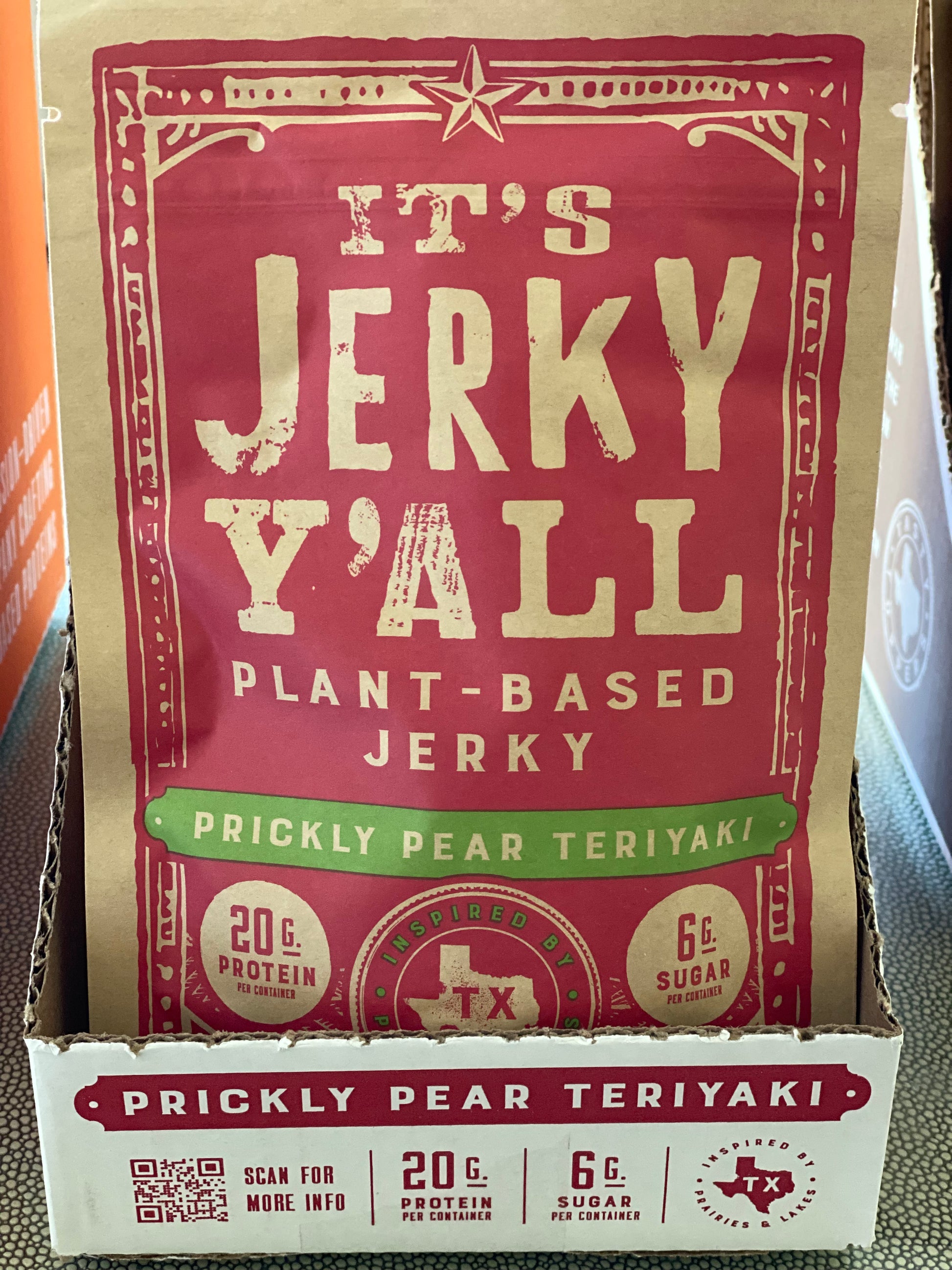 Close-up of It's Jerky Y'all Prickly Pear Teriyaki plant-based jerky packaging, highlighting 20g of protein and 6g of sugar per serving, a perfect option for healthy vegan snacks to buy and healthy vegan snack ideas.